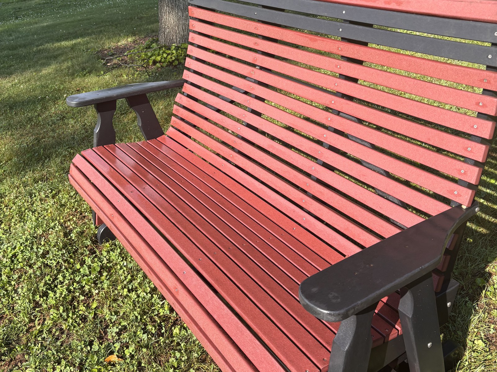 The same bench after cleaning, with deep red colour restored