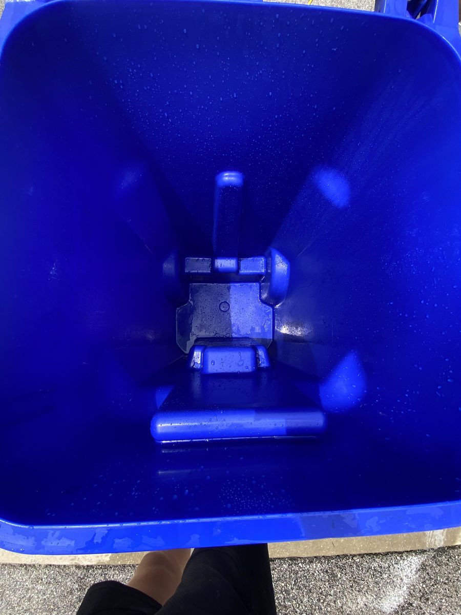 The same trash can spotless and sanitized after cleaning inside and out